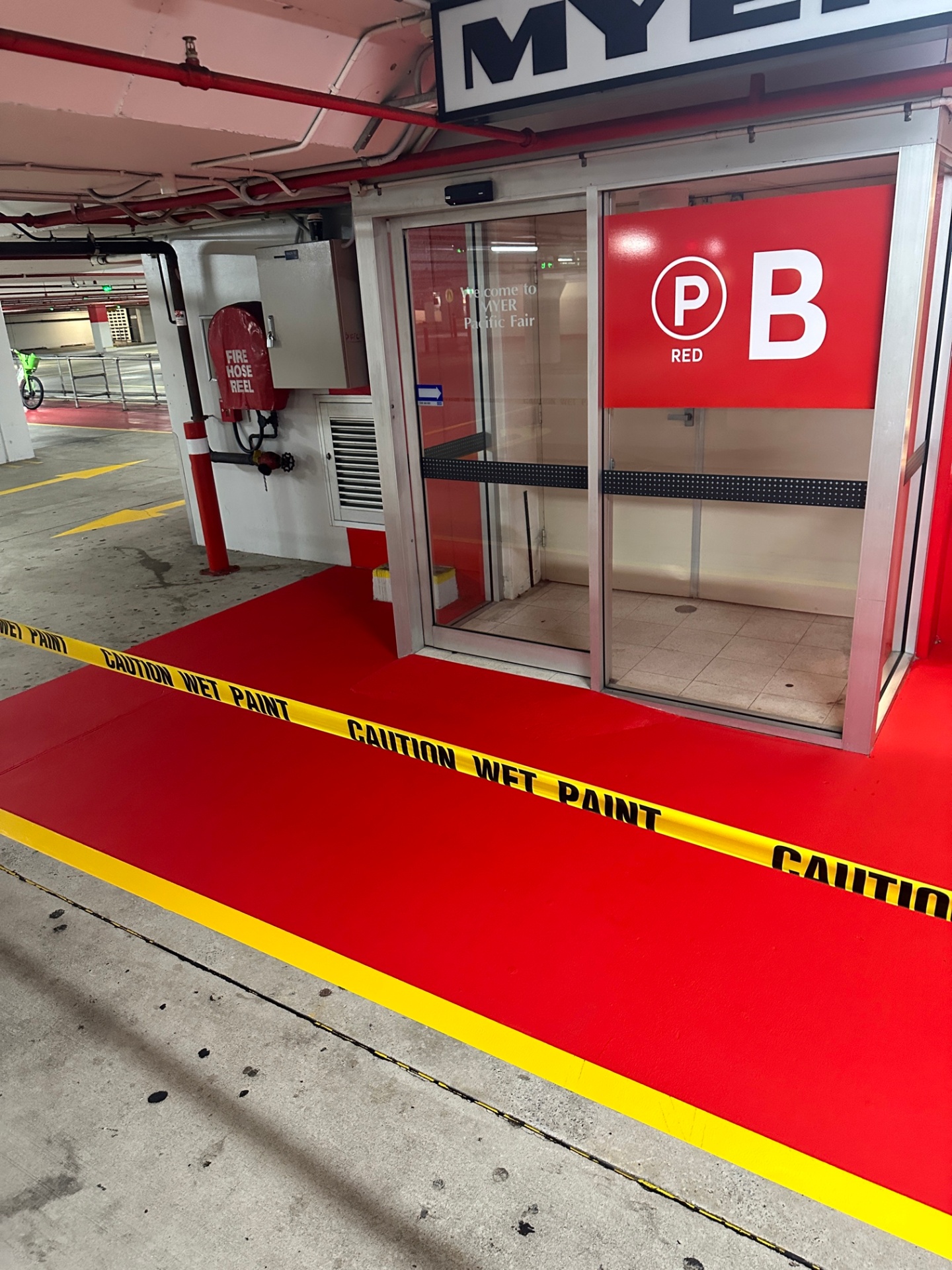 Red painted floor zone and yellow kerb line at Pacific Fair shopping centre