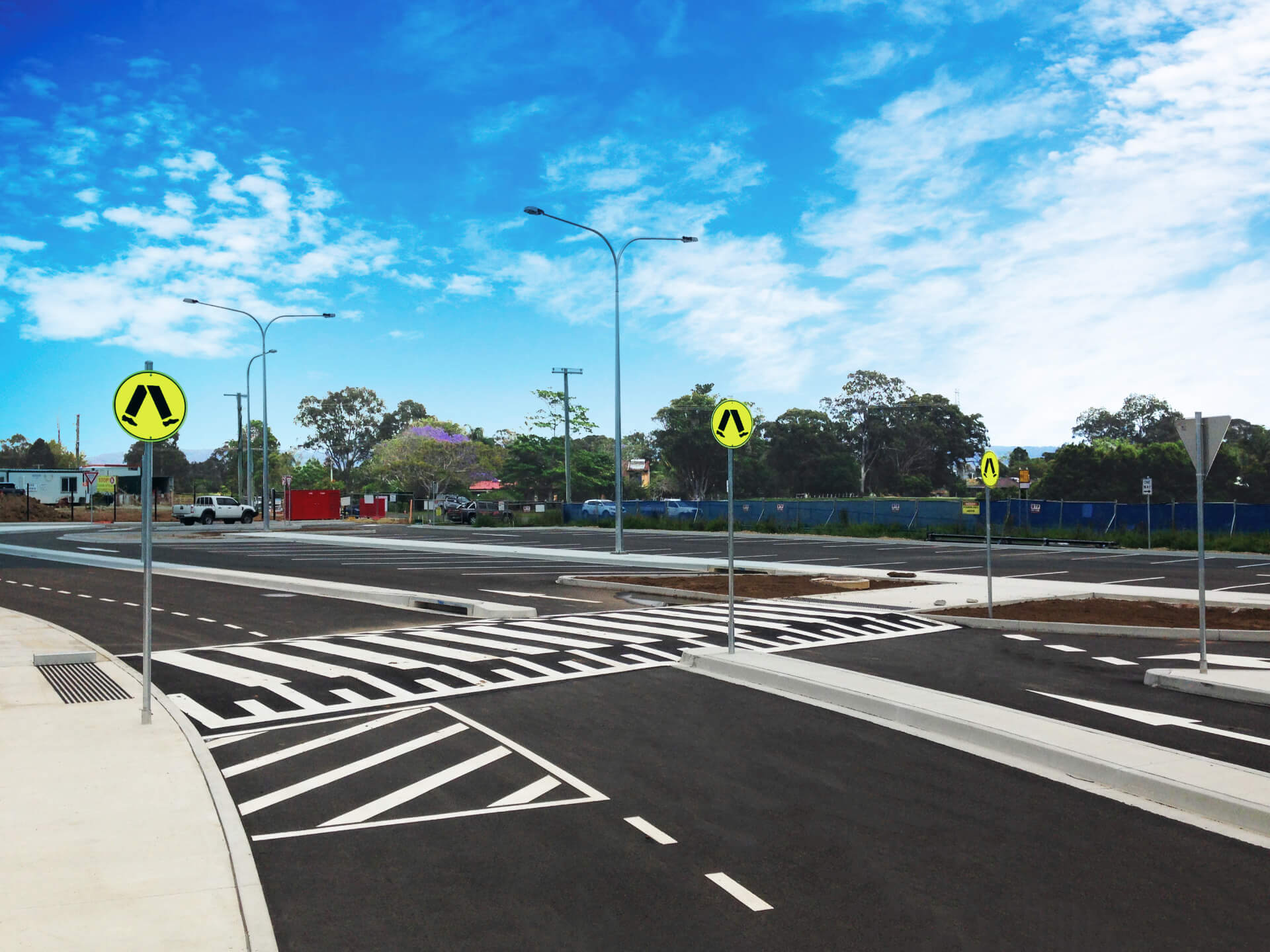 Newly marked car park with pedestrian crossings and signage